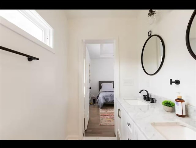 bathroom with vanity and hardwood / wood-style flooring