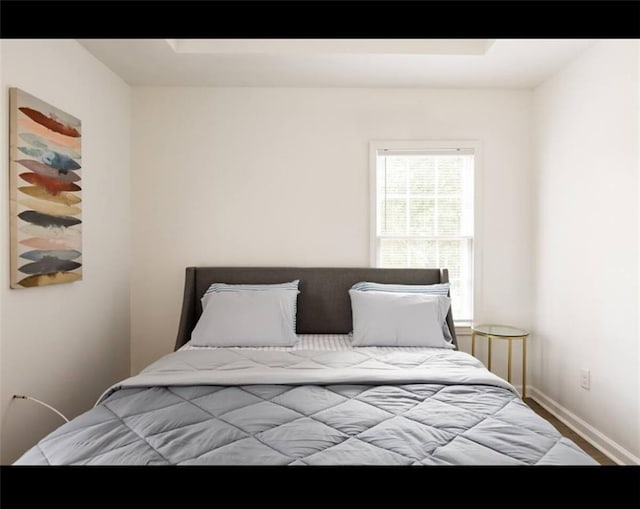 bedroom featuring wood-type flooring