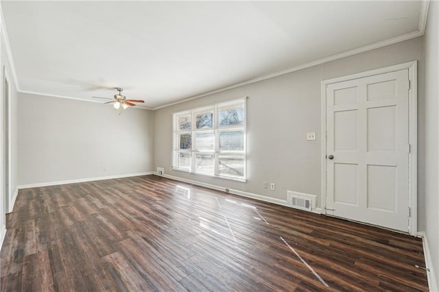 interior space with dark wood-type flooring, ornamental molding, ceiling fan, and baseboards