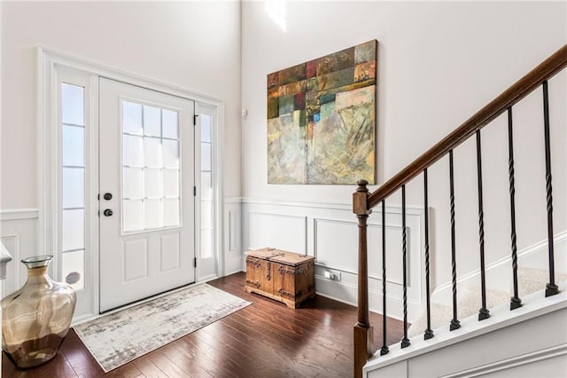 entryway with dark hardwood / wood-style floors