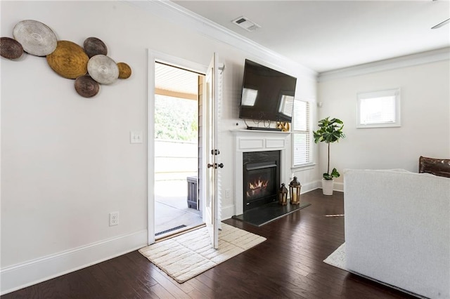 living room with ornamental molding and dark hardwood / wood-style floors