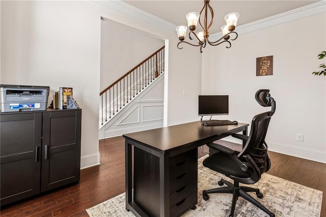 office area with an inviting chandelier, ornamental molding, and dark wood-type flooring