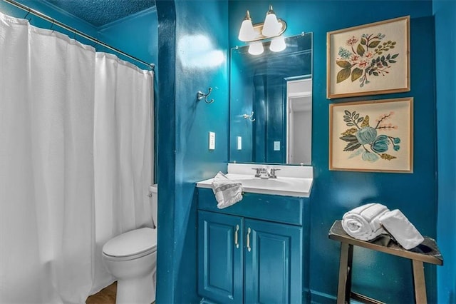 bathroom featuring vanity, a textured ceiling, curtained shower, and toilet