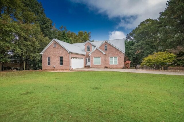 back of house with a lawn