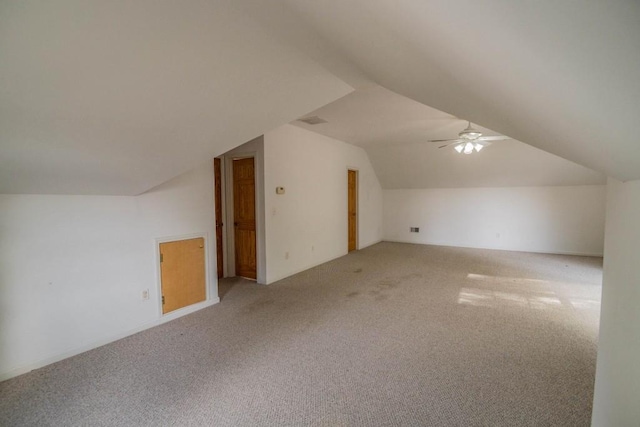 bonus room featuring light carpet, lofted ceiling, and ceiling fan