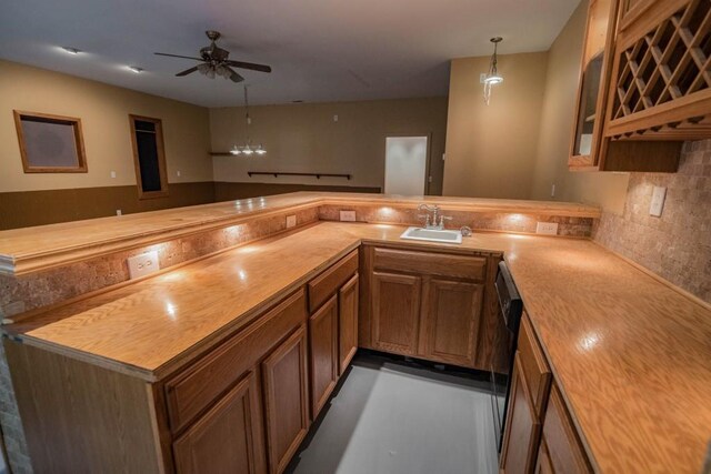 kitchen with kitchen peninsula, decorative backsplash, ceiling fan, decorative light fixtures, and butcher block countertops