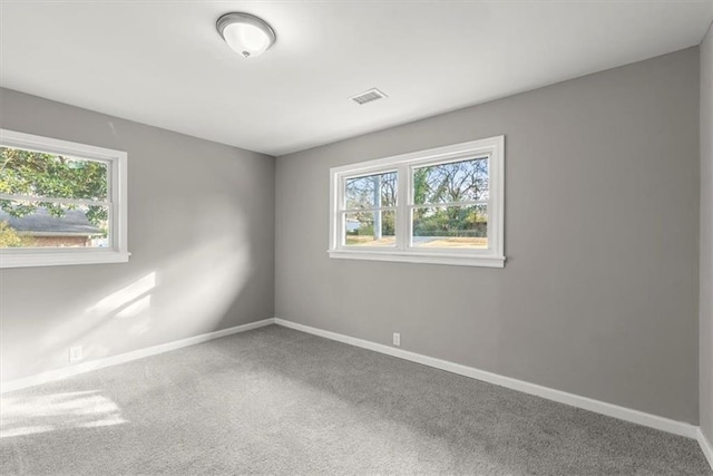 unfurnished room with carpet flooring