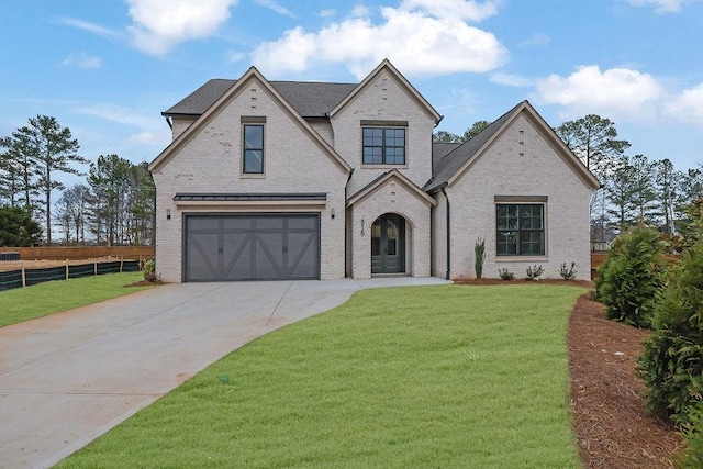 view of front facade with a front yard and a garage