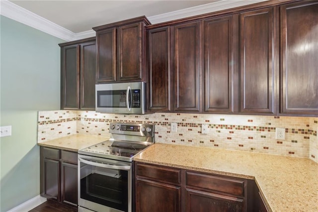 kitchen with crown molding, stainless steel appliances, light stone counters, dark brown cabinetry, and decorative backsplash