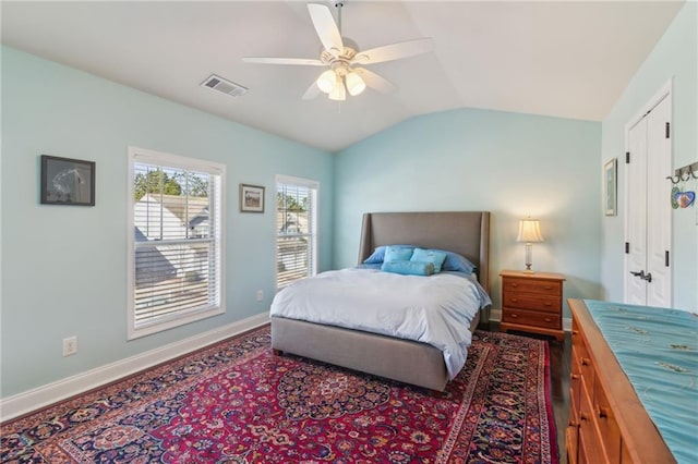 bedroom featuring dark wood-type flooring, ceiling fan, and lofted ceiling