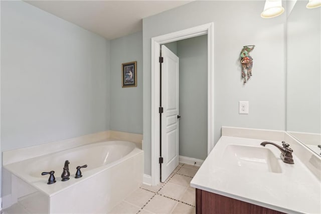 bathroom featuring vanity, a bath, and tile patterned flooring