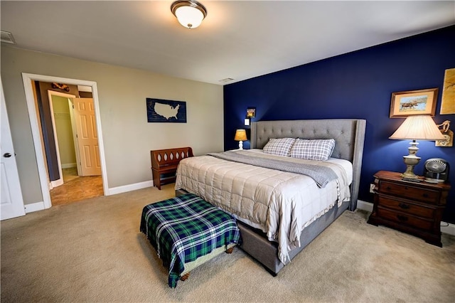 bedroom with carpet flooring, visible vents, and baseboards