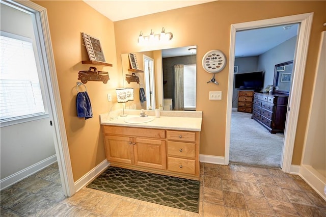 bathroom featuring vanity and baseboards