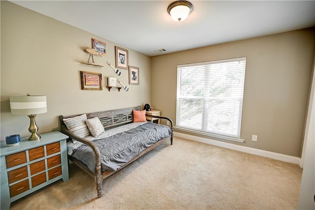 bedroom featuring carpet flooring, visible vents, and baseboards