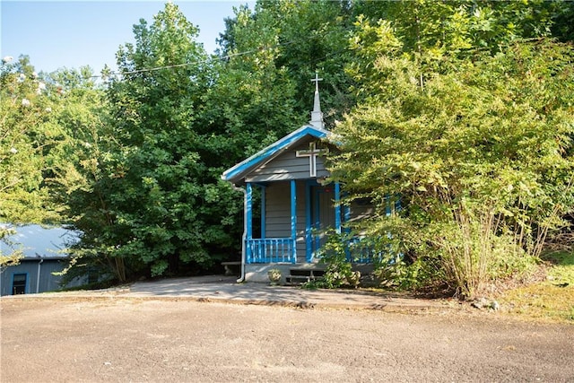 view of outbuilding featuring covered porch