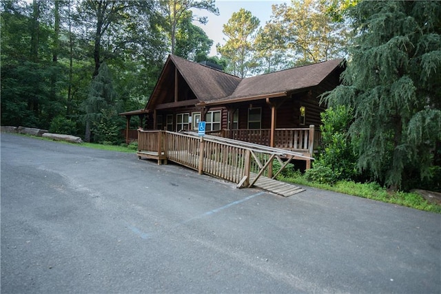 view of front of property with a wooden deck