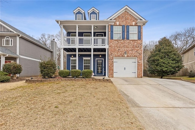 view of front of home with a balcony, a garage, and a front lawn