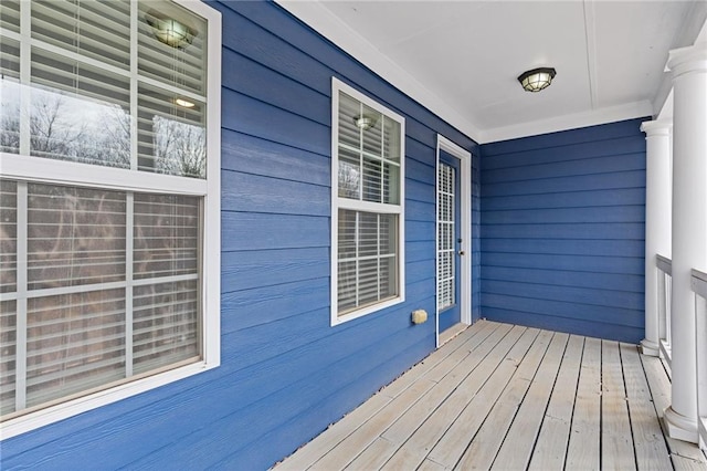 wooden terrace featuring covered porch