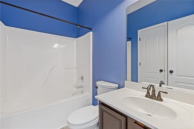 full bathroom with vanity, toilet, and  shower combination