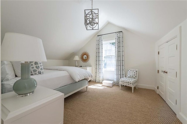 bedroom with carpet flooring and vaulted ceiling