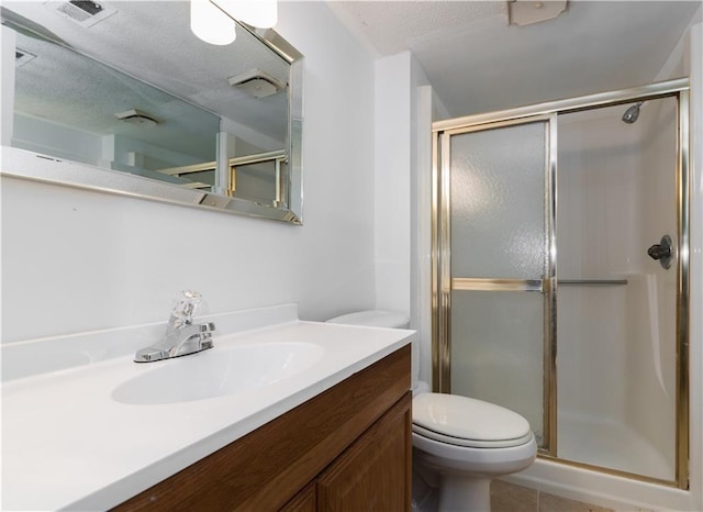 full bath with visible vents, toilet, a shower stall, and a textured ceiling