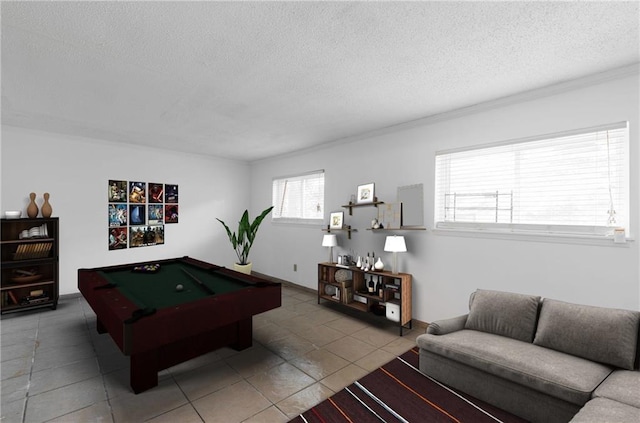 game room with a textured ceiling and pool table