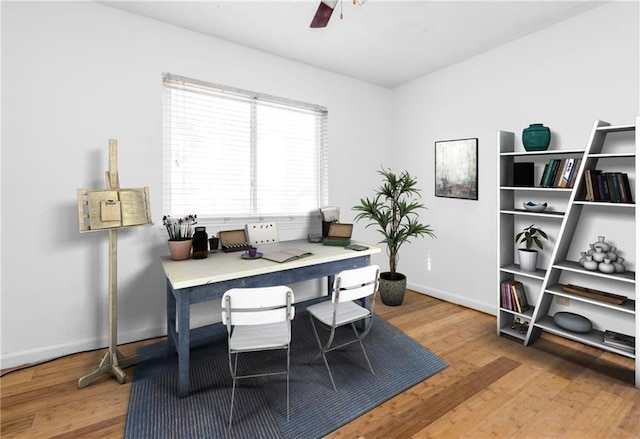 office with ceiling fan, wood finished floors, and baseboards