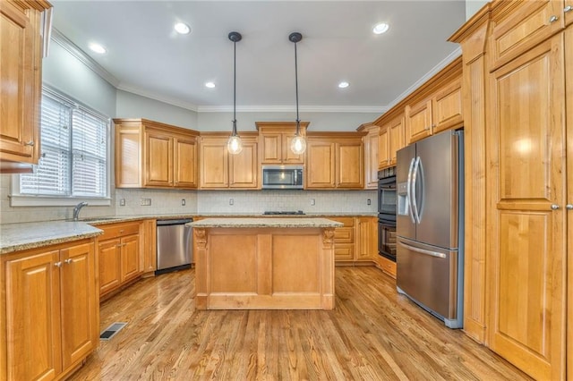 kitchen featuring tasteful backsplash, light stone counters, a center island, pendant lighting, and stainless steel appliances