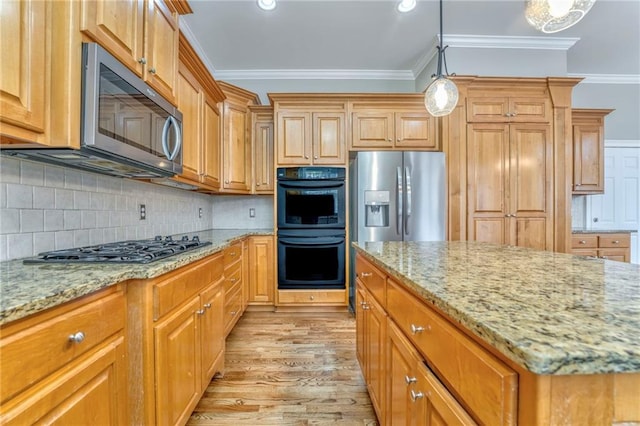 kitchen with crown molding, stainless steel appliances, light stone counters, tasteful backsplash, and decorative light fixtures