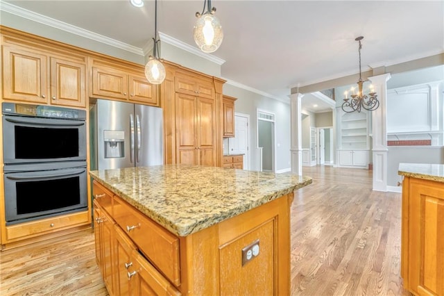 kitchen with ornate columns, decorative light fixtures, ornamental molding, a center island, and stainless steel appliances