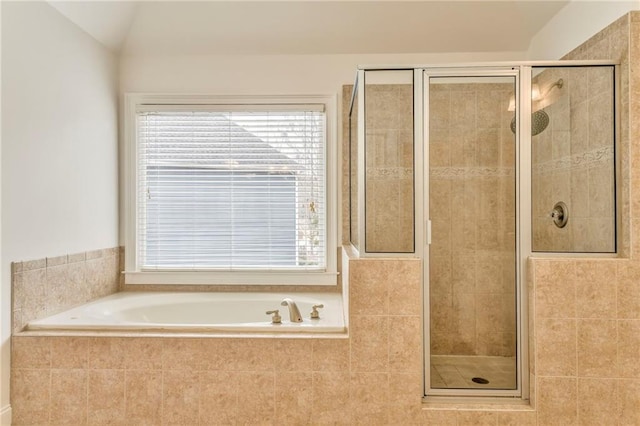 bathroom with vaulted ceiling and separate shower and tub