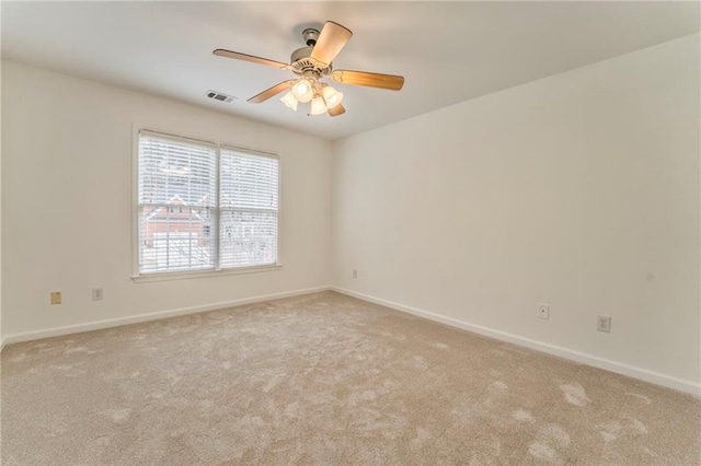 carpeted empty room with ceiling fan