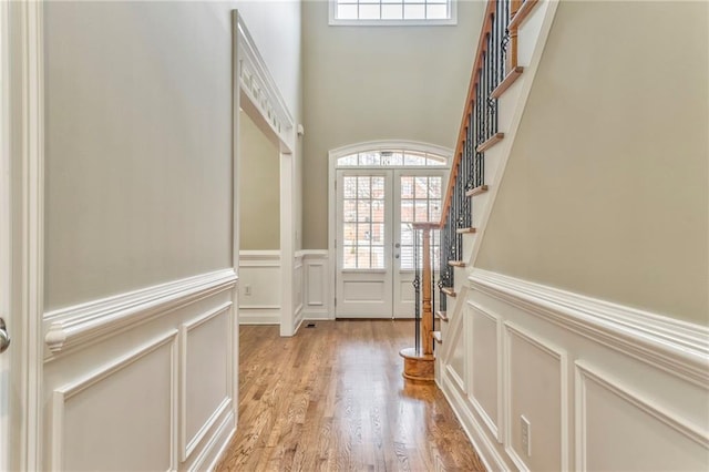 doorway featuring french doors and light hardwood / wood-style flooring