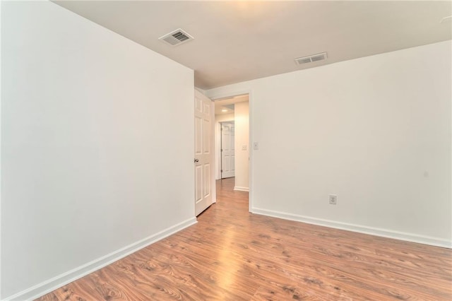 spare room featuring light hardwood / wood-style floors