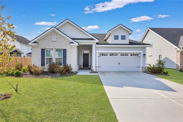 view of front facade with a garage and a front yard