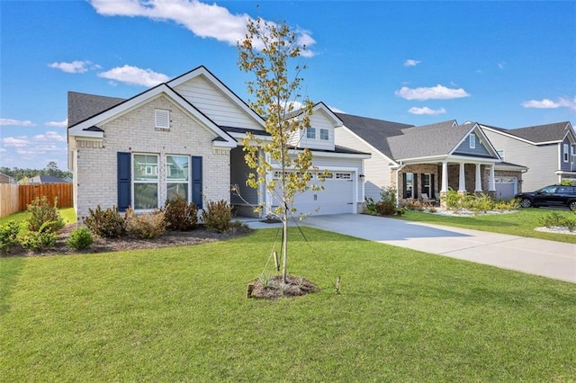 view of front of home featuring a garage and a front lawn