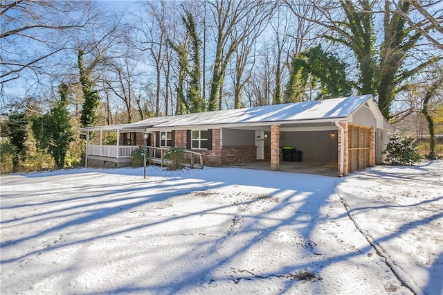 single story home with a garage and covered porch