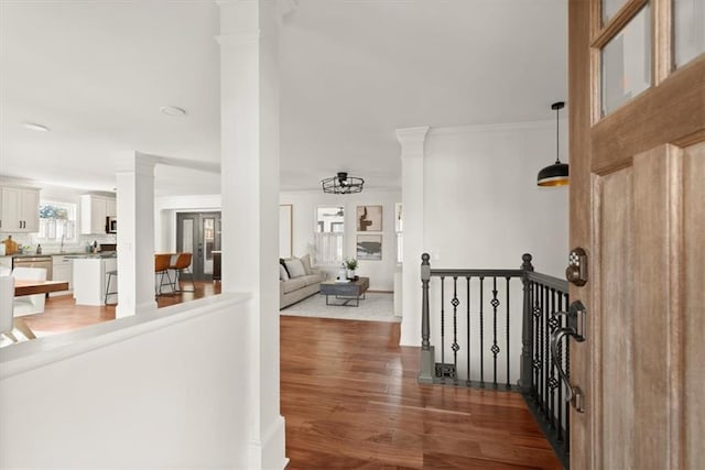 hallway featuring a notable chandelier and dark hardwood / wood-style flooring