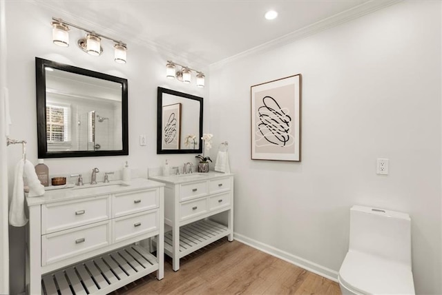 bathroom featuring toilet, vanity, hardwood / wood-style flooring, a shower, and ornamental molding