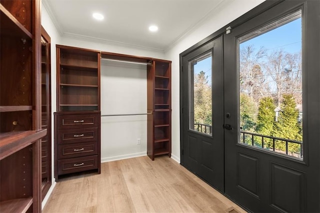 interior space with french doors and light wood-type flooring