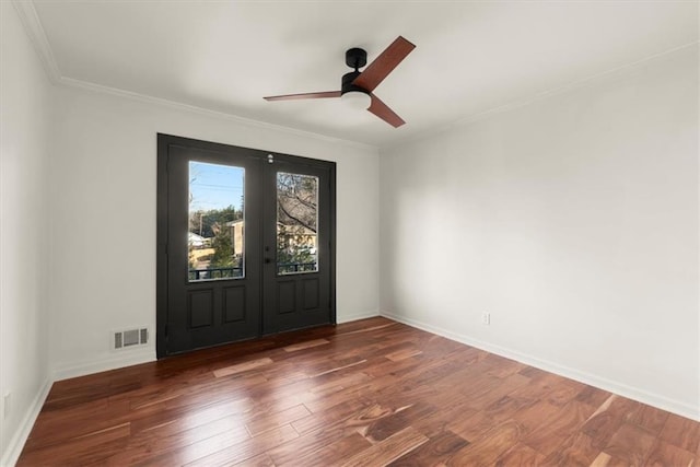 entrance foyer with ceiling fan, dark hardwood / wood-style flooring, and ornamental molding