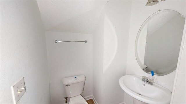 176 Silver Fox Trl, Dallas, GA 30157 - half bathroom featuring toilet, a sink, and baseboards