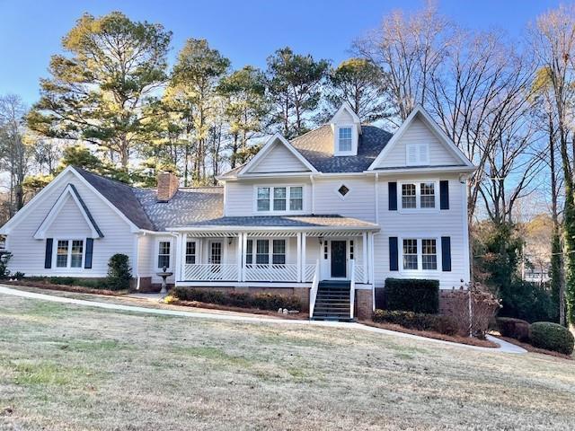 view of front of house featuring a front lawn and a porch