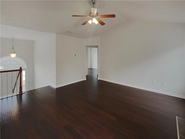 unfurnished room featuring lofted ceiling, dark hardwood / wood-style flooring, and ceiling fan