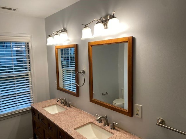 bathroom with vanity and toilet