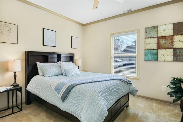 carpeted bedroom featuring visible vents, ceiling fan, crown molding, and baseboards