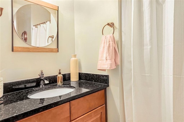 full bathroom with a shower with shower curtain and vanity