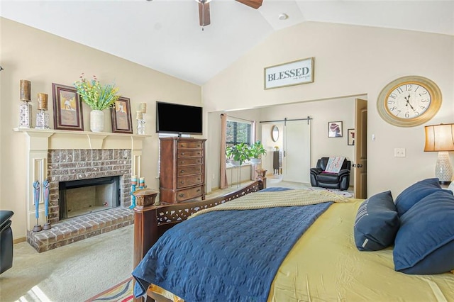 bedroom featuring lofted ceiling, carpet, a brick fireplace, and ceiling fan