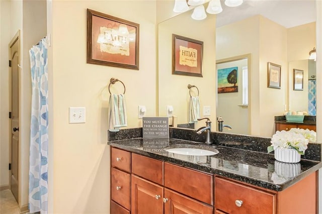 bathroom featuring vanity and a shower with shower curtain