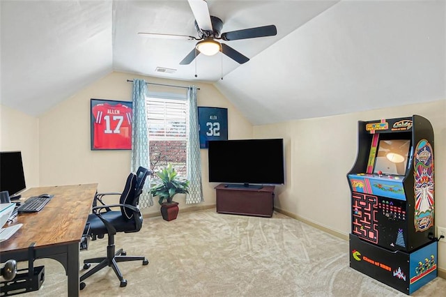 office featuring lofted ceiling, a ceiling fan, baseboards, and carpet floors